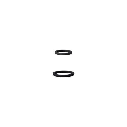 Two black rubber washers on a white background