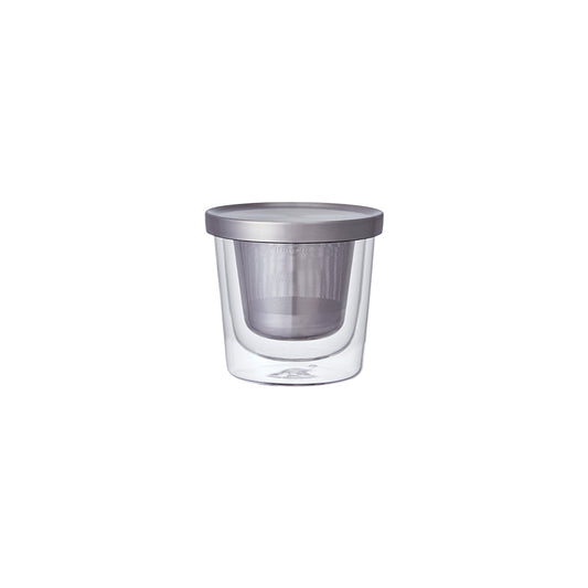 Clear glass mug with metal lid on a white background