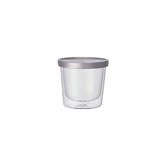 Clear glass container with a silver lid on a white background