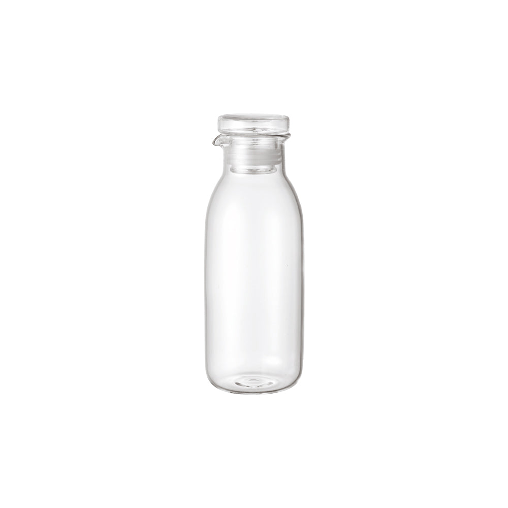 Clear glass bottle on a white background