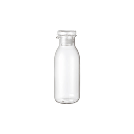 Clear glass bottle on a white background