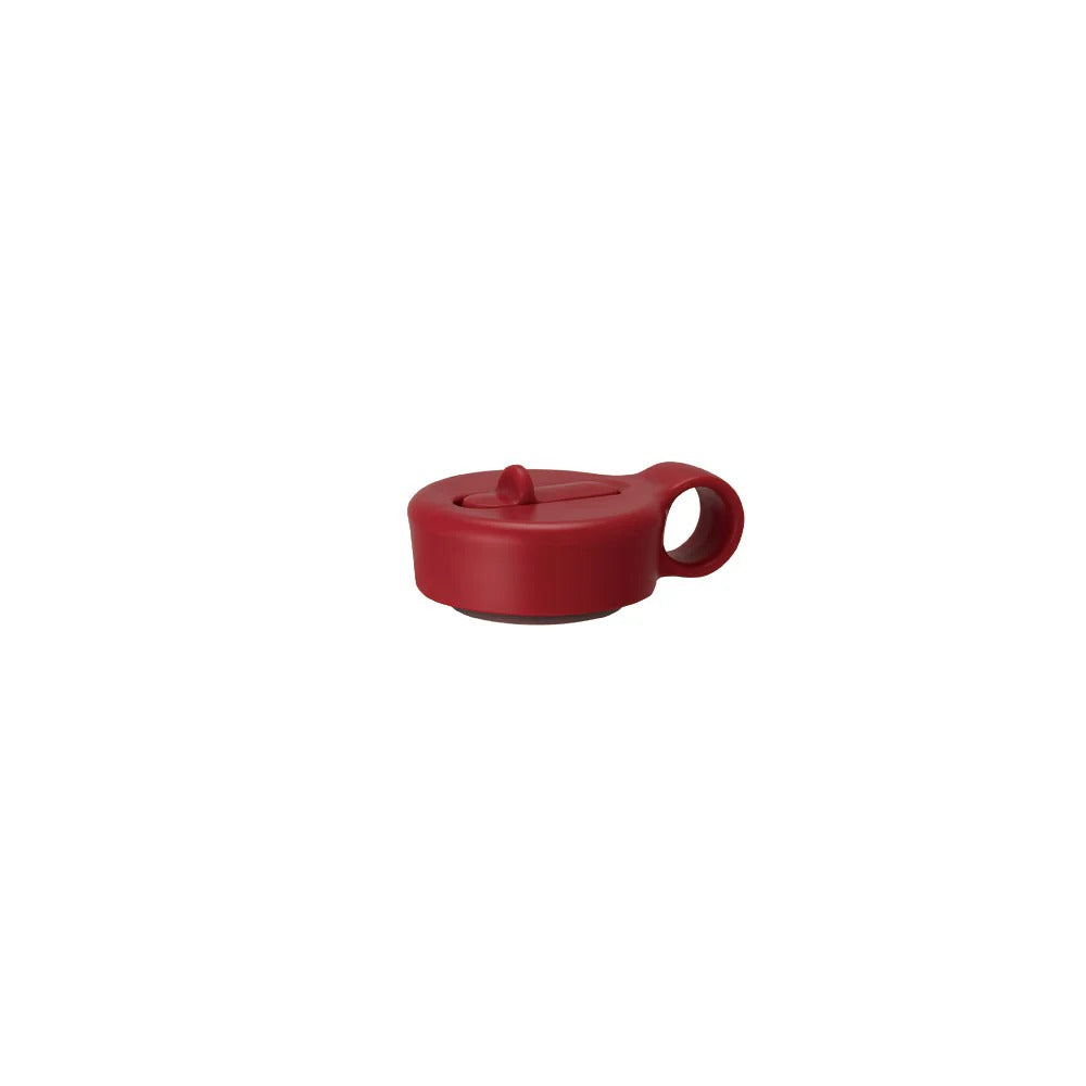 Red plastic clip on a white background