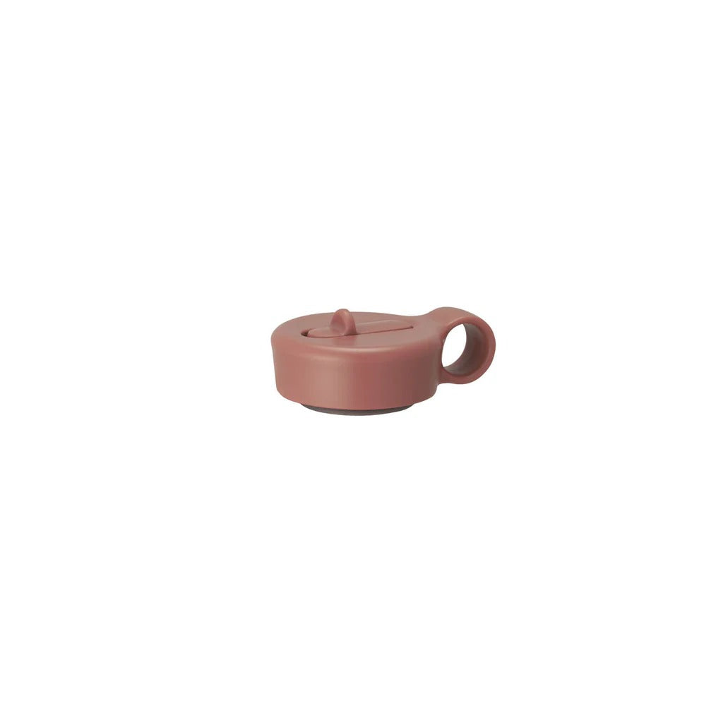 Pink silicone lid on a white background