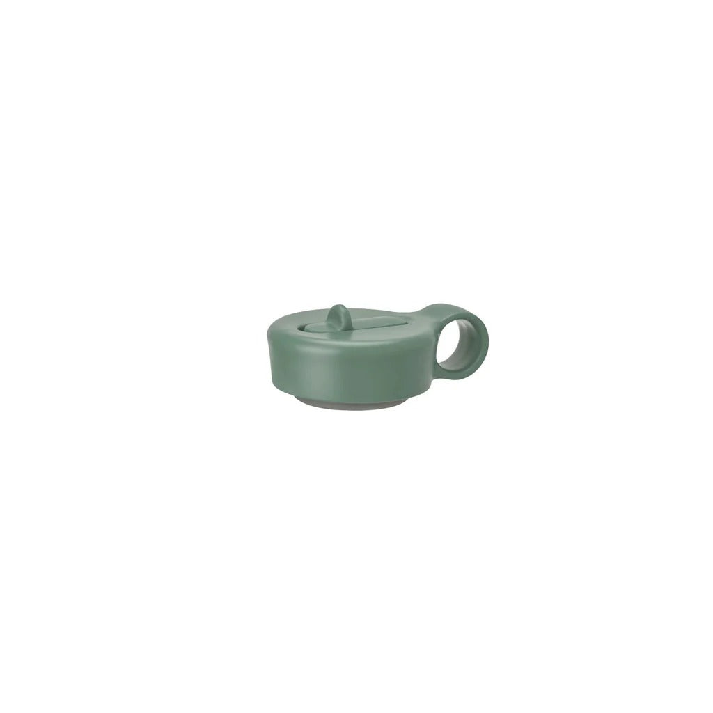 Green ceramic mug on a white background