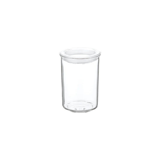 Clear glass jar with a white lid on a white background