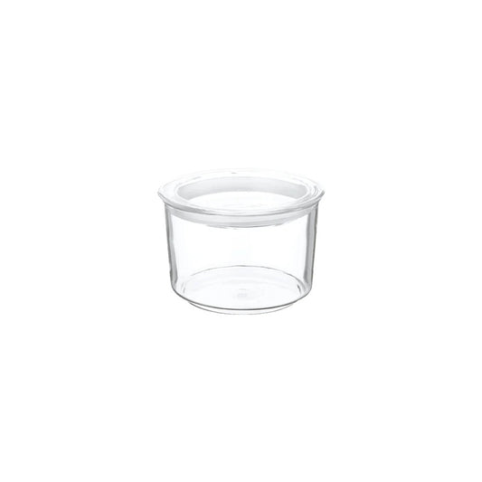 Clear plastic container with a white lid on a white background